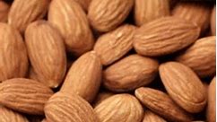 Heap of whole almonds, rotation