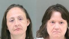 Women charged after incapacitated child found living among waste