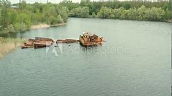 Aerial view of boat, ship and barge graveyard on the Pripyat river abandoned after Chernobyl disaster. Cemetery of ships and barges. Abandoned ships of Chernobyl. Pripyat river. Pripyat city.