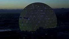 Las Vegas , United States - 02 06 2024: Illuminated MSG Sphere With Emoji Face On Surface Looking Around. Static Shot, Establishing
