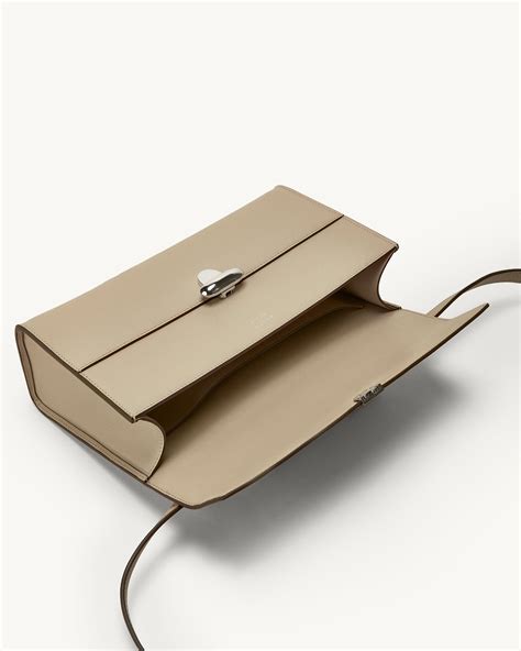 SAVETTE - Symmetry 26 in Bone Leather – The Iconic Issue