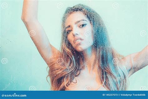 Beautiful Woman in the Shower Behind Glass with Drops. Stock Image ...