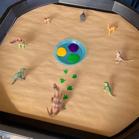Dinosaur footprints tuff tray | Dinosaur activities preschool, Nursery ...