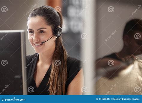 Female Customer Services Agent Working at Desk in Call Center Stock ...