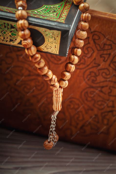 Premium Photo | Muslim prayer beads on holy book