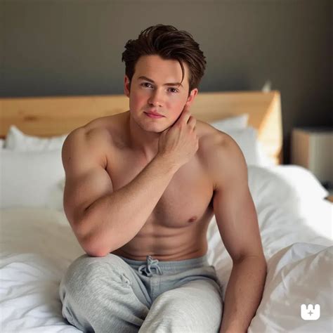 Kit Connor sits shirtless on a bed covered in ... by stephentwest on ...