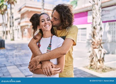 Man and Woman Couple Smiling Confident Hugging Each Other at Street ...