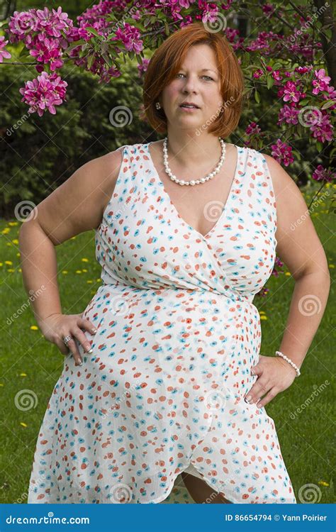 Overweight mature woman stock photo. Image of cherry - 86654794