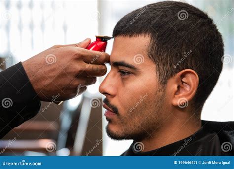 African-American Barber`s Hand Uses Razor and Haircut on Hispanic ...