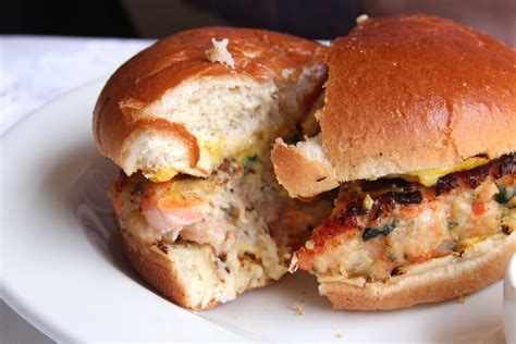 Scallop, prawn & crab burger, served in a brioche bun with rouille ...