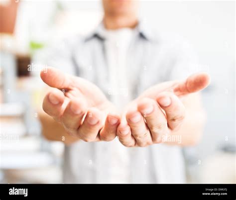 Male hands holding something hi-res stock photography and images - Alamy