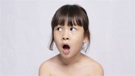 beautiful young Asian girl looks shocked at things. The girl gave a surprised expression and ...
