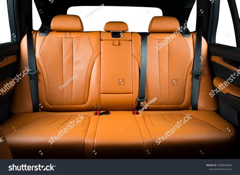 Back passenger seats in modern luxury car frontal view redo perforated leather with stitching ...