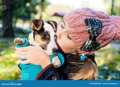 Cute Girl Kissing Her Dog in Nature Outdoors. Stock Photo - Image of ...