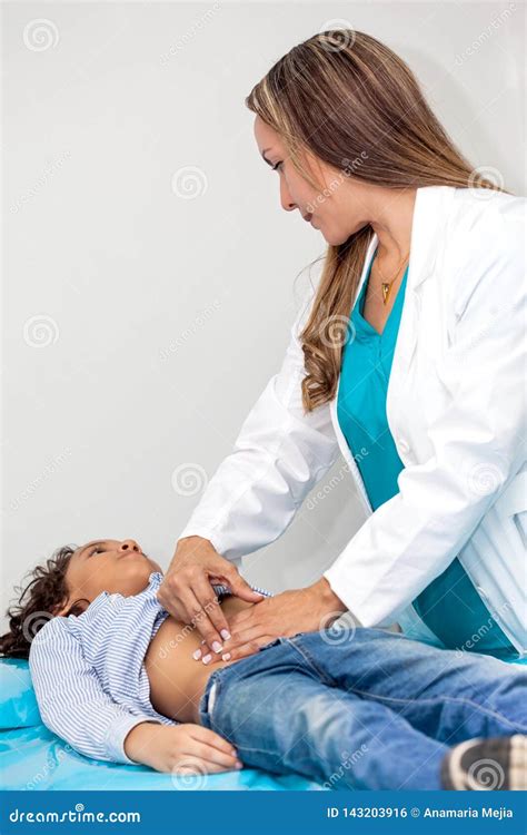 Doctor Examining and Performing the Technique of Abdominal Percussion ...
