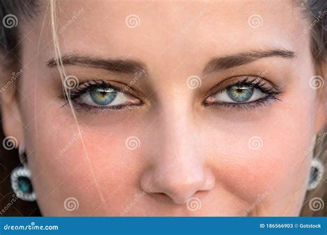 Close Up Female Portrait on Intense Piercing Blue Eyes, Confident ...