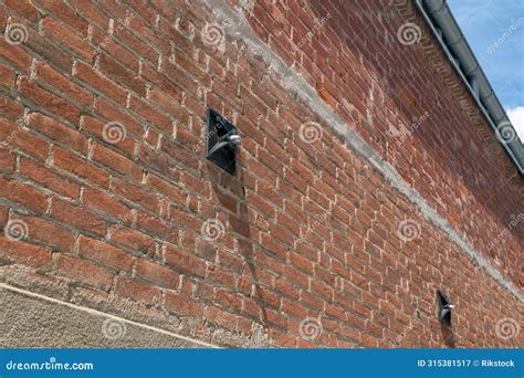 Tie Rod on the Wall of an Exposed Brick Building with Construction ...