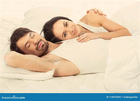 White Beautiful Girl Lies on Sleeping White Man Stock Image - Image of ...