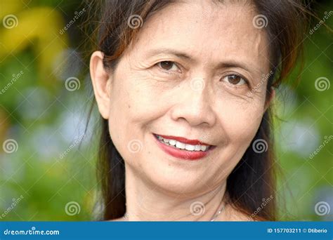 An Older Filipina Female Senior Smiling Stock Image - Image of smiling, aging: 157703211