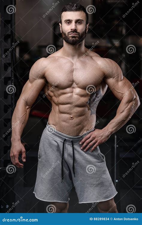 Handsome Fitness Model Train in the Gym Gain Muscle Stock Photo - Image ...