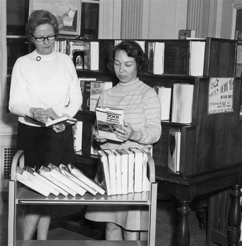 Library clerks process new books for the Crandall Public Library in ...