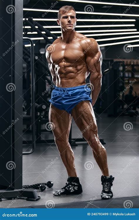 Muscular Man in Gym Showing Muscles, Working Out. Strong Male Naked ...