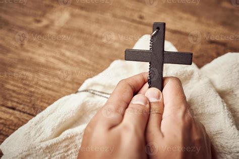 Concept of Christian. close up of hand praying holding a Jesus Christ ...
