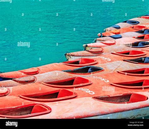 Colourful yellow and red kayaks on turquoise sea water background Stock ...