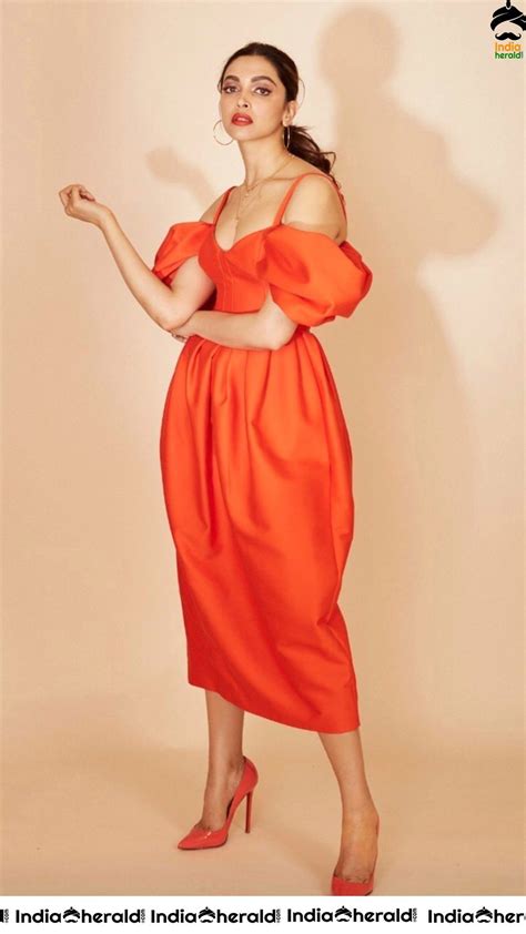 Deepika Padukone Oozes Sex Appeal in Orange Cleavage Cut Dr