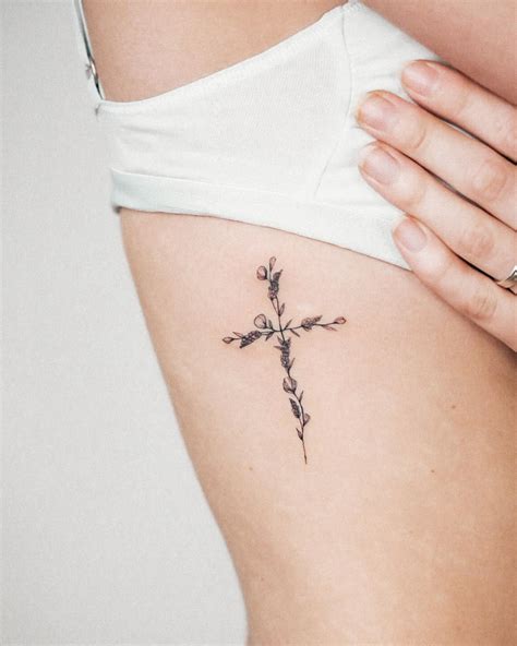 Girly cross tattoo on wrist - Eagleviewtattoo.com