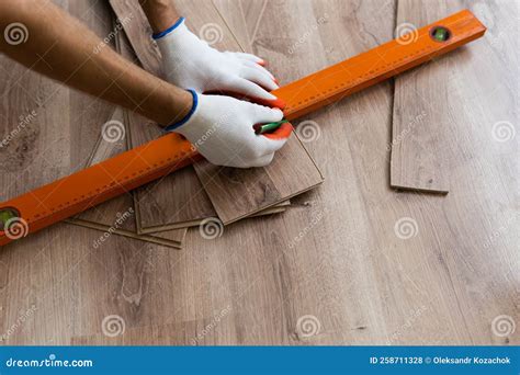Laminate Flooring Improvement. Installer Contractor Installing New ...
