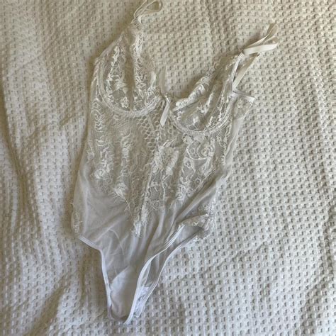 White lace bodysuit. Sheer cups but a nude or white... - Depop