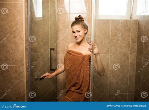 Sexy, Young Girl Takes a Shower in the Bathroom on a Brown Tile ...