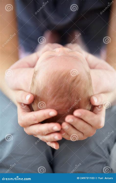 My Whole World in My Hands. Closeup Cropped Shot of a Mother Cradling ...