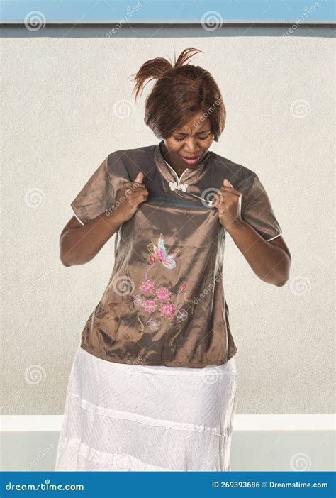 African Woman Ripping Off Her Clothes Stock Photo - Image of angry ...