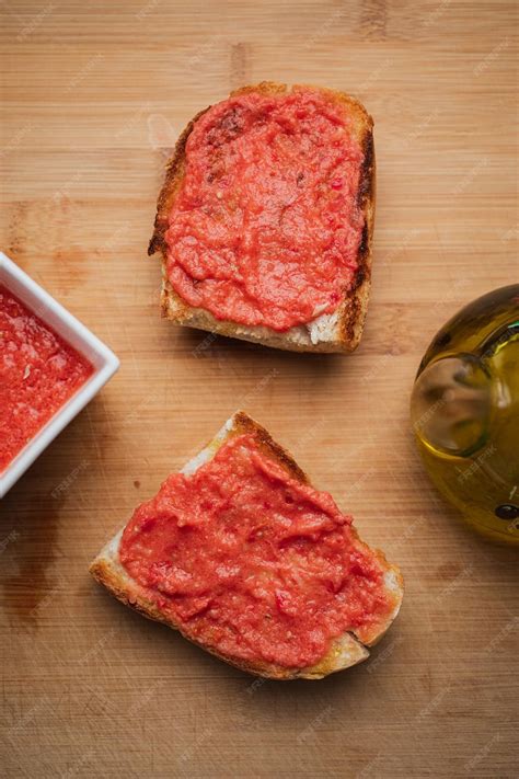 Premium Photo | Shot of two spanish tomato toasts for breakfast toast ...