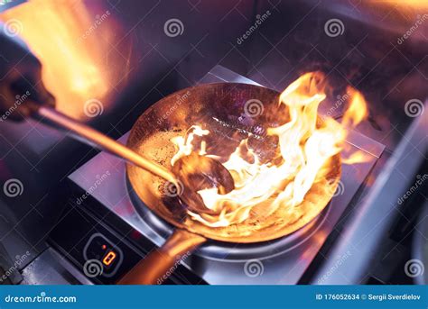 Flame from a Wok while Cooking Stock Photo - Image of dinner, flames ...