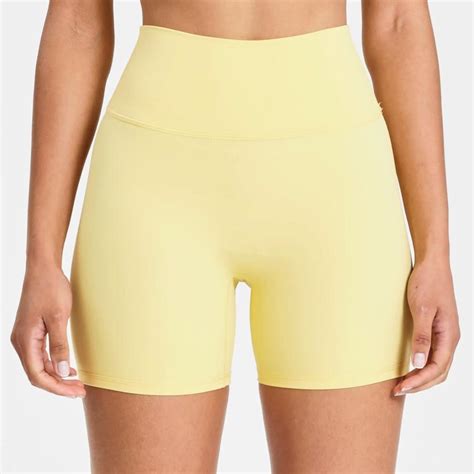 Yellow bike shorts Brand: Allfenix - CLOUDCORE... - Depop