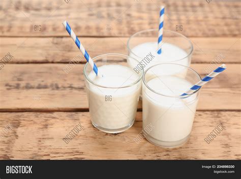 Glasses Milk On Wooden Image & Photo (Free Trial) | Bigstock