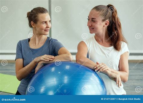 Two Women Standing with Big Exercise Ball after Yoga Class with Happy ...