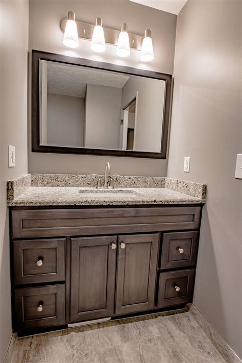 Re-Bath Omaha remodels include custom Bertch vanities. Dark wood stain ...