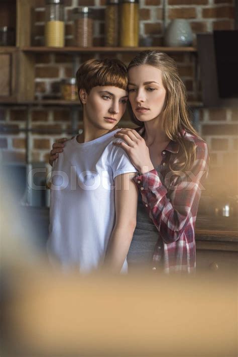beautiful young lesbian couple on kitchen at home | Stock image | Colourbox