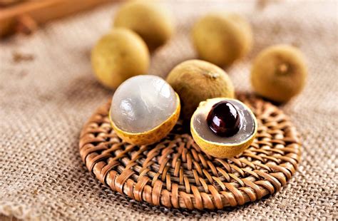 Download Longan Fruits On Coaster Wallpaper | Wallpapers.com