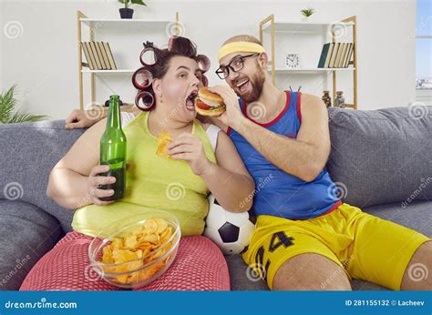 Funny Man and Fat Woman Having Cheat Day, Sitting on Sofa and Eating ...