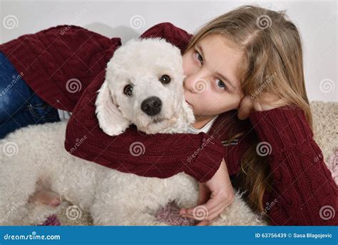 Girl kissing her dog stock image. Image of friendship - 63756439