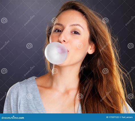 Woman Blowing a Bubble with Bubble Gum Stock Photo - Image of grey ...