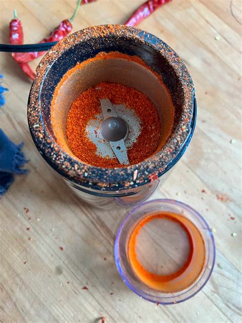 Powdered paprika in a spice grinder.
