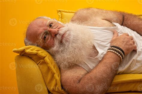 Old man with a long beard on a yellow background. Senior with full ...