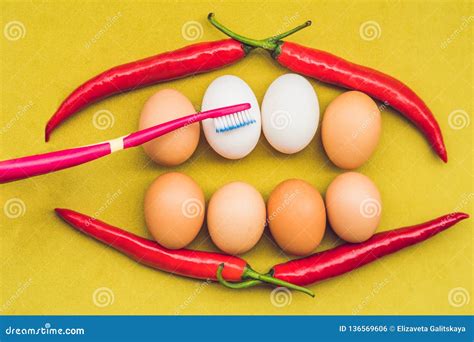 Eggs and Red Pepper in the Form of a Mouth with Teeth. White Eggs are ...