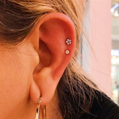 A trend we are loving lately is double helix piercings! You can really ...